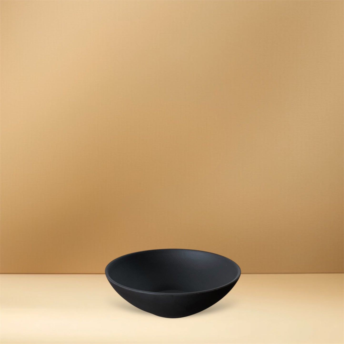 Charcoal black TOKI yunomi tea cup with smooth curves and matte yakishime texture, handcrafted in Tokoname, Japan.