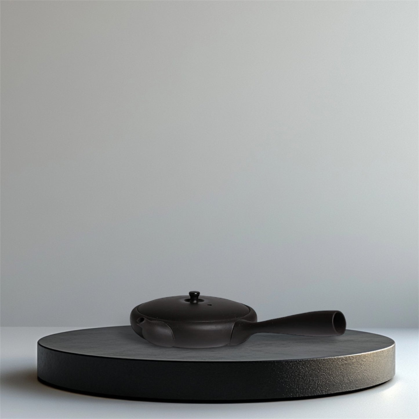 Gokuhira Kyusu teapot from the TOKI series by JINSU, handcrafted in Tokoname with yakishime finish; ultra-flat silhouette and internal strainer.